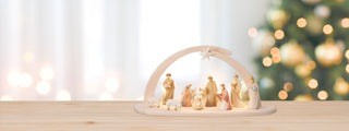 Italian Wood Carved Nativity Set infront of Chritsmas background